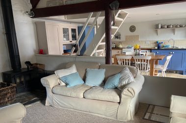 The sitting room - with view of kitchen and stairs to twin bedroom