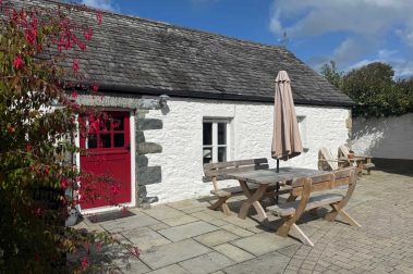 Crab Cottage is rustic converted farm building dating back to 1887. It has thick stone walls and a slate tiled roof. Inside, there are exposed beams and traditional whitewashed stone walls.