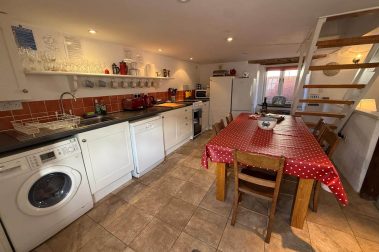 The kitchen is simple, but well equipped. Appliances include a freestanding electric cooker with ceramic hob, fridge-freezer, microwave, dishwasher and washer-dryer. Cafetieres and teapots are supplied.